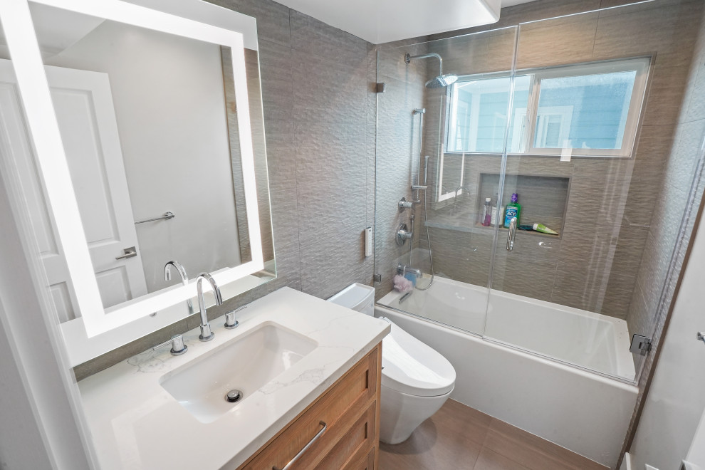 This is an example of a large modern family bathroom in Orange County with beaded cabinets, light wood cabinets, a built-in bath, a bidet, white tiles, slate tiles, white walls, cement flooring, quartz worktops, an open shower, white worktops, a single sink and a built in vanity unit.