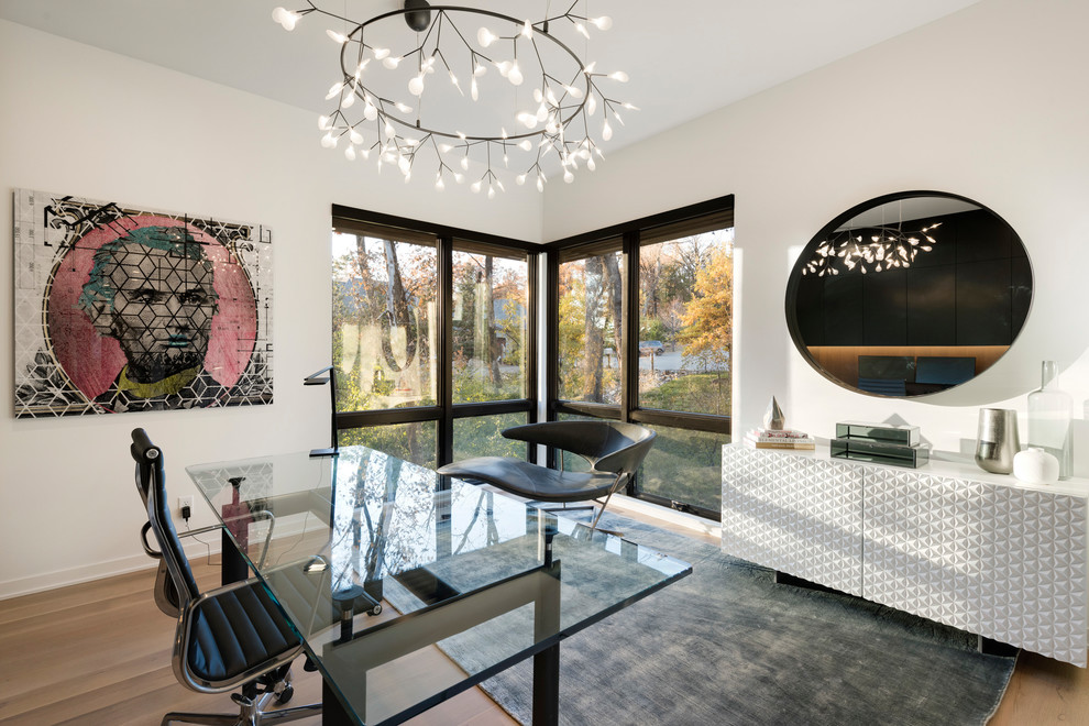 Inspiration for a contemporary freestanding desk medium tone wood floor and brown floor home office remodel in Minneapolis with white walls