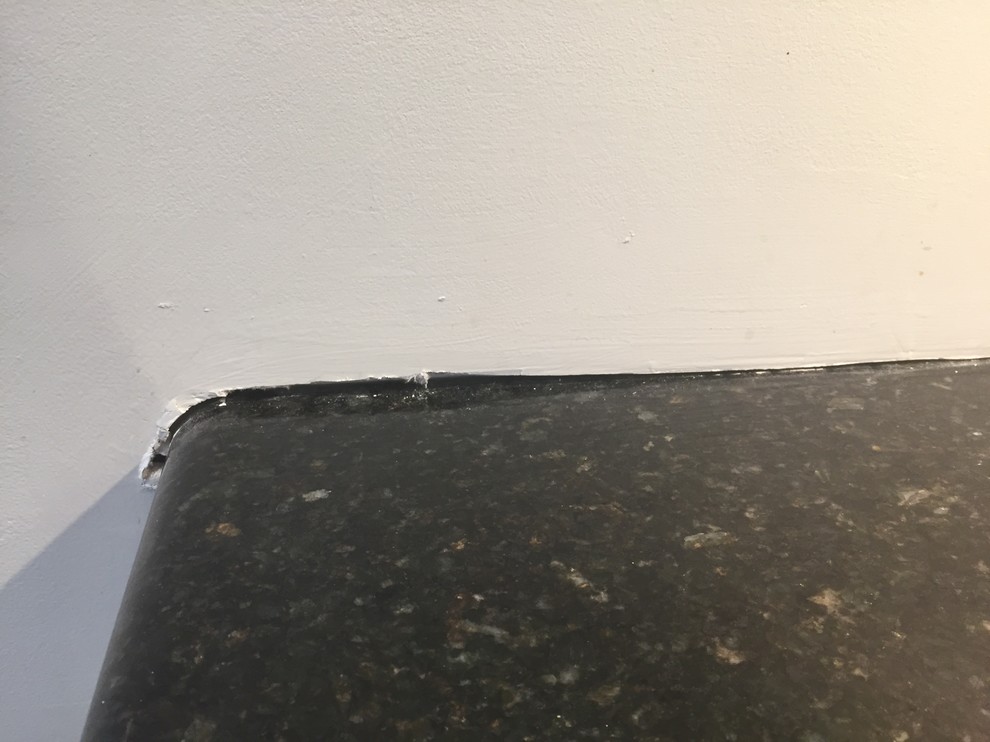 How to fix 1/4" gap in drywall above granite counter