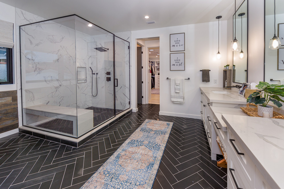 Large transitional bathroom in Los Angeles with white tile, white walls, white benchtops, white cabinets, a corner shower, an undermount sink, black floor, a niche, a shower seat and shaker cabinets.