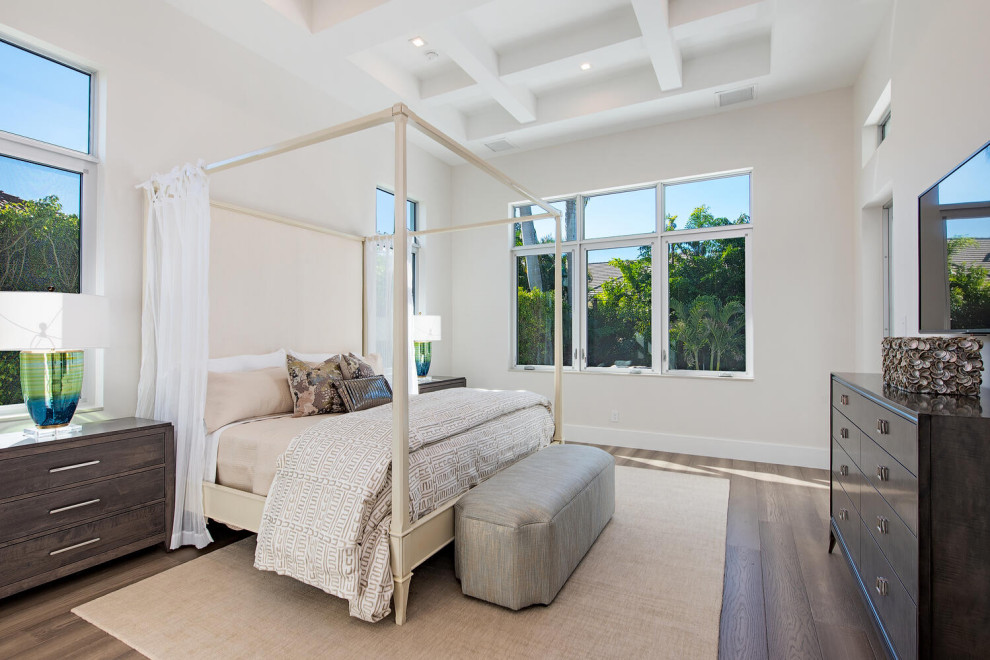 This is an example of a medium sized world-inspired master bedroom in Other with beige walls, dark hardwood flooring, brown floors and a coffered ceiling.