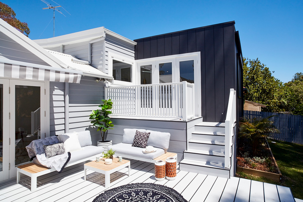 Inspiration for a mid-sized modern side yard deck in Sydney with no cover.