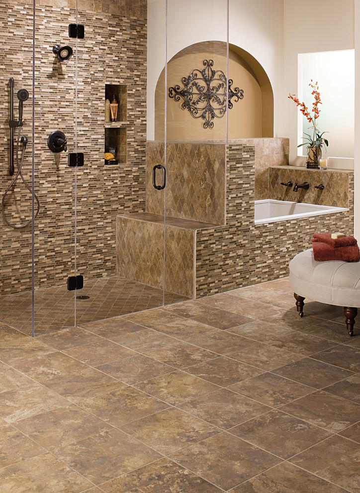 Design ideas for a mid-sized master bathroom in Other with a drop-in tub, a curbless shower, beige tile, brown tile, gray tile, multi-coloured tile, matchstick tile, beige walls, travertine floors, brown floor and a hinged shower door.