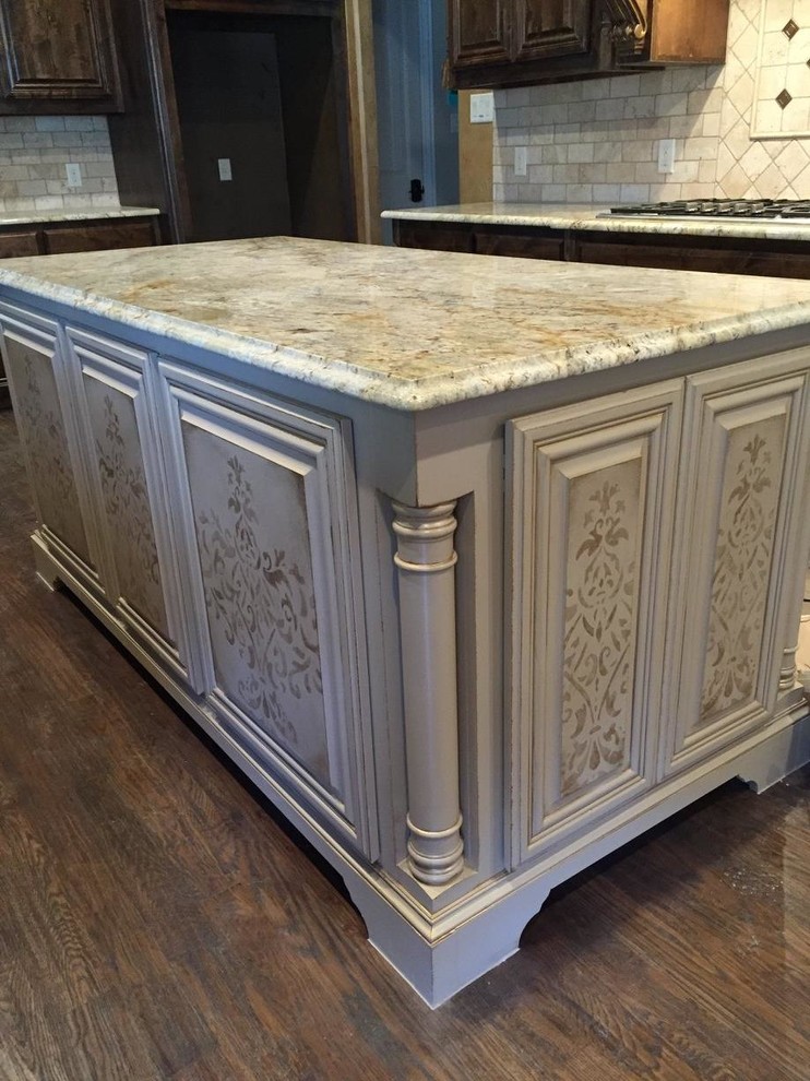 Inspiration for a mediterranean kitchen in Dallas with beige cabinets, granite benchtops, medium hardwood floors and multiple islands.