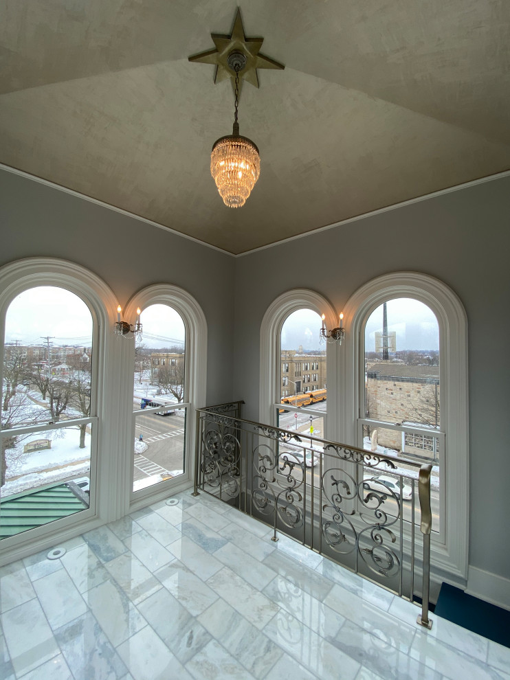 This is an example of a small traditional sunroom in Milwaukee with marble floors and white floor.