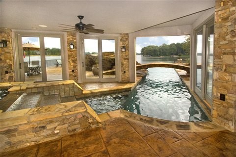 Lake House Pool with a 40\' vanishing edge and a carved concrete ... Lake House Pool with a 40\' vanishing edge and a carved concrete ...