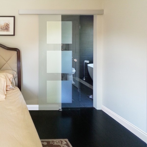 Inspiration for a large modern master bedroom in Chicago with beige walls and black floor.