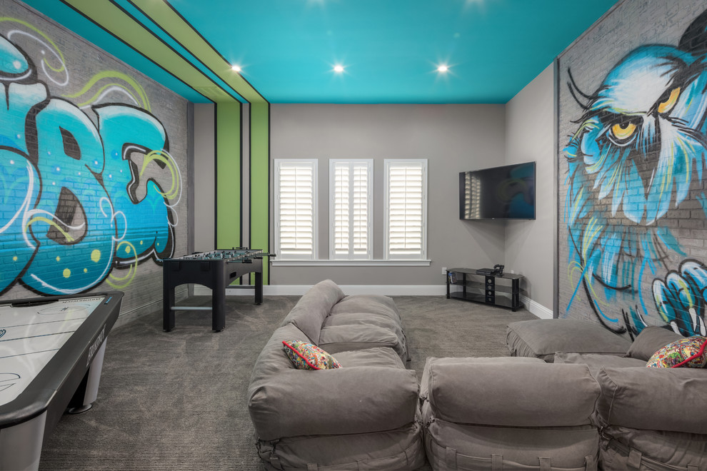 Contemporary family room in Orlando with a game room, multi-coloured walls, carpet, a wall-mounted tv and grey floor.