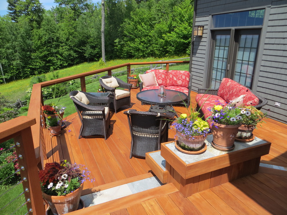 Photo of a large traditional backyard patio in Boston with decking and no cover.