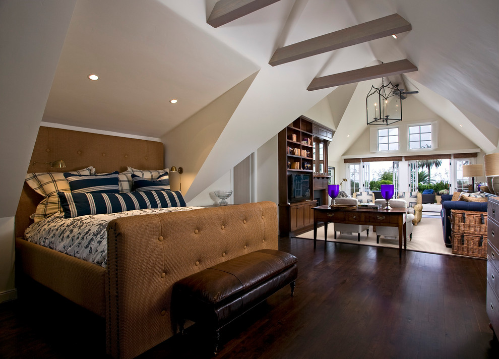 Large country master bedroom in Santa Barbara with beige walls, dark hardwood floors and no fireplace.