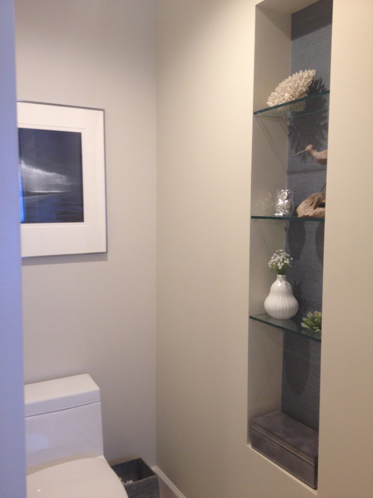 Inspiration for a mid-sized transitional master blue tile and subway tile light wood floor and blue floor freestanding bathtub remodel with flat-panel cabinets, distressed cabinets, beige walls, an undermount sink, solid surface countertops and a hinged shower door