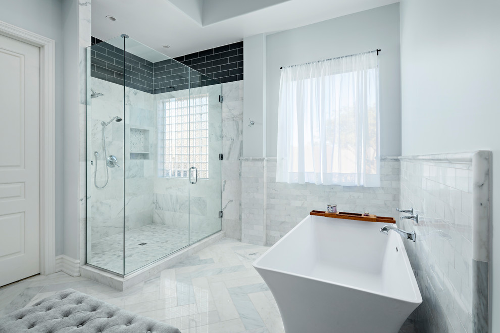 Large transitional master bathroom in Phoenix with raised-panel cabinets, black cabinets, a freestanding tub, a corner shower, a one-piece toilet, white tile, marble, grey walls, marble floors, an undermount sink, engineered quartz benchtops, white floor and an open shower.