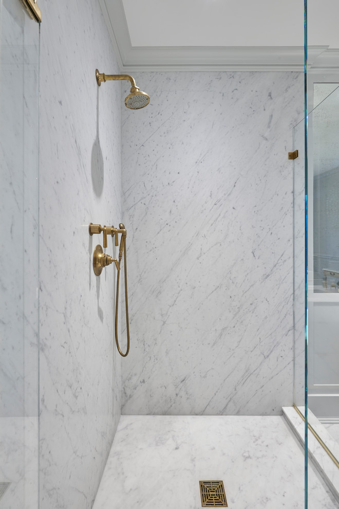 Design ideas for a transitional bathroom in New York with a corner shower, marble floors, an undermount sink, marble benchtops and a hinged shower door.