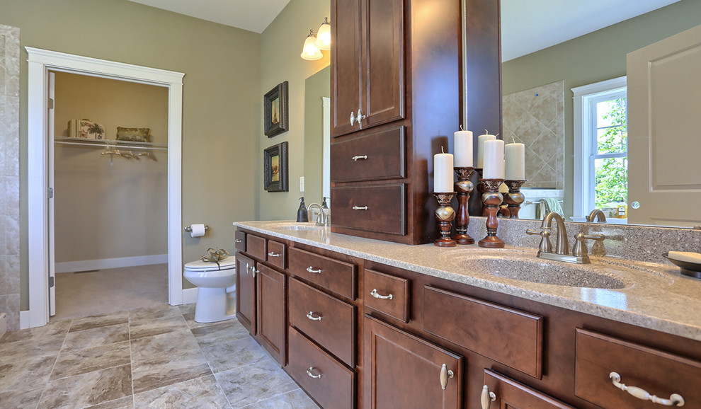 Large arts and crafts master bathroom in Other with dark wood cabinets, green walls, ceramic floors, recessed-panel cabinets, terrazzo benchtops, a freestanding tub, a two-piece toilet and an integrated sink.
