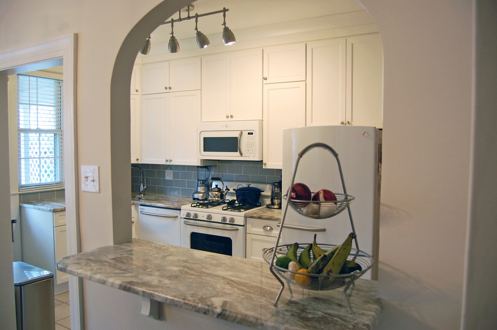 Example of a small transitional eat-in kitchen design in Baltimore with a drop-in sink, flat-panel cabinets, white cabinets, marble countertops, gray backsplash, glass tile backsplash, stainless steel appliances and an island