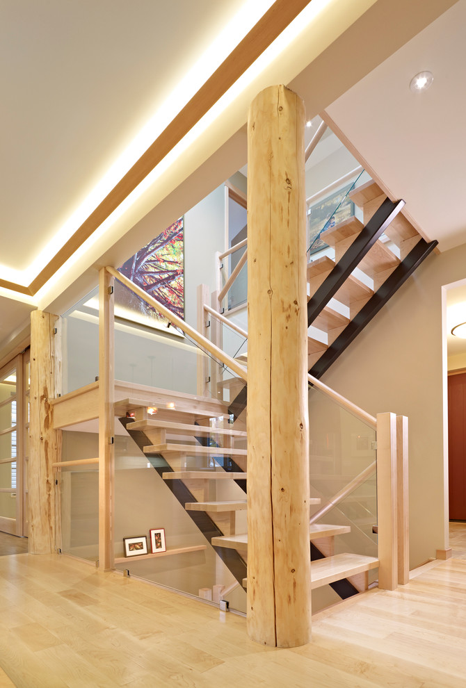 Inspiration for a traditional wood u-shaped staircase in Edmonton with open risers.