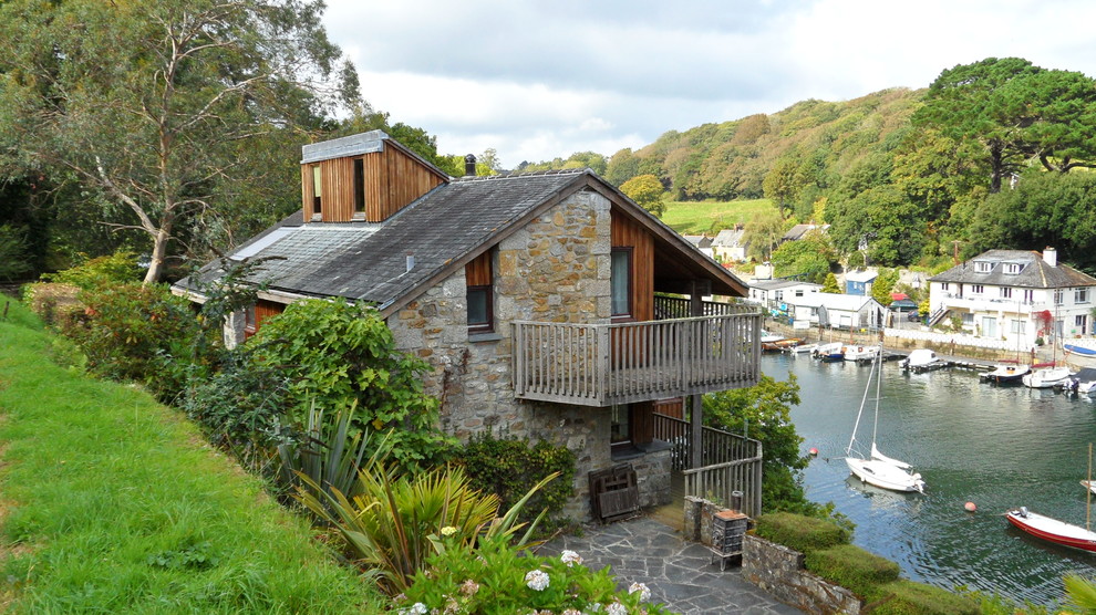 Inspiration for a country two-storey exterior in Cornwall with mixed siding.