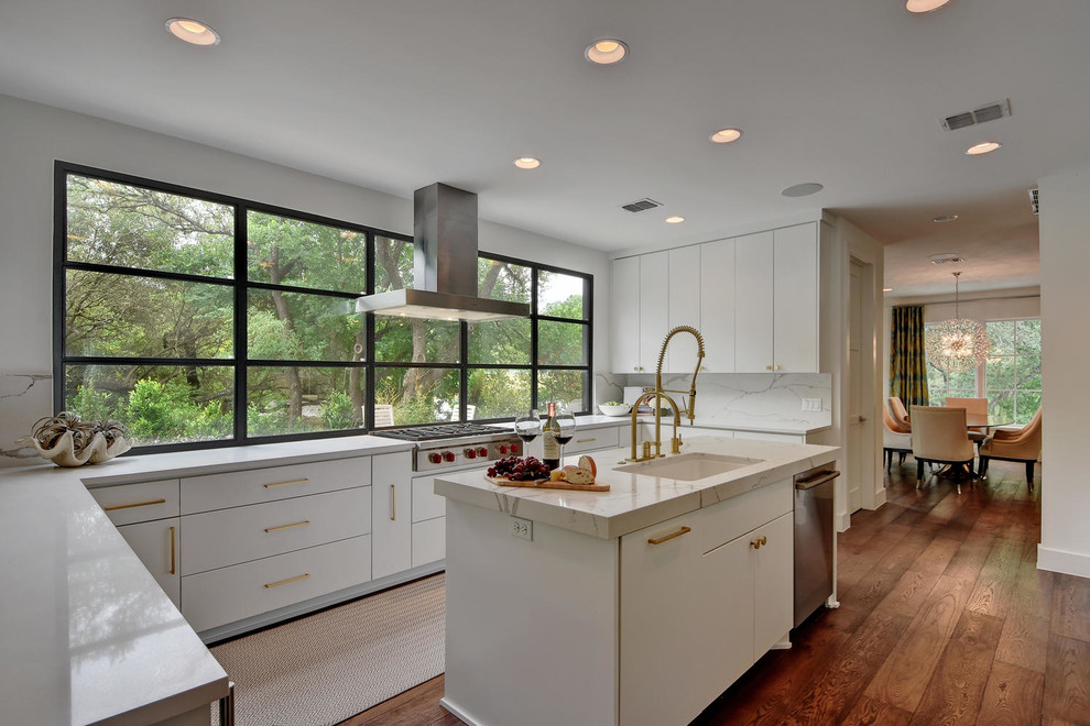 Inspiration for a contemporary u-shaped separate kitchen in Austin with an undermount sink, flat-panel cabinets, white cabinets, window splashback, stainless steel appliances, medium hardwood floors and with island.