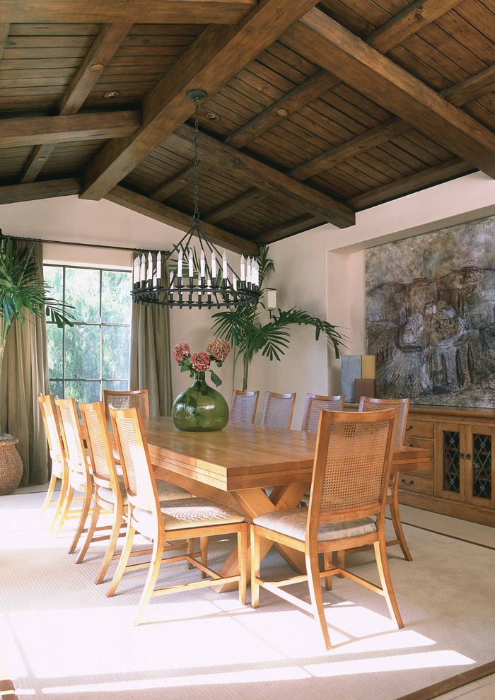 Inspiration for a tropical dining room in Los Angeles with white walls.