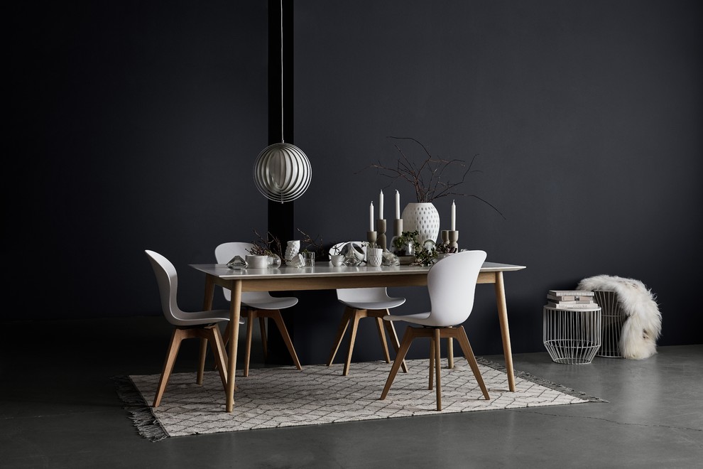 Inspiration for a small contemporary kitchen/dining combo in Manchester with grey walls and concrete floors.