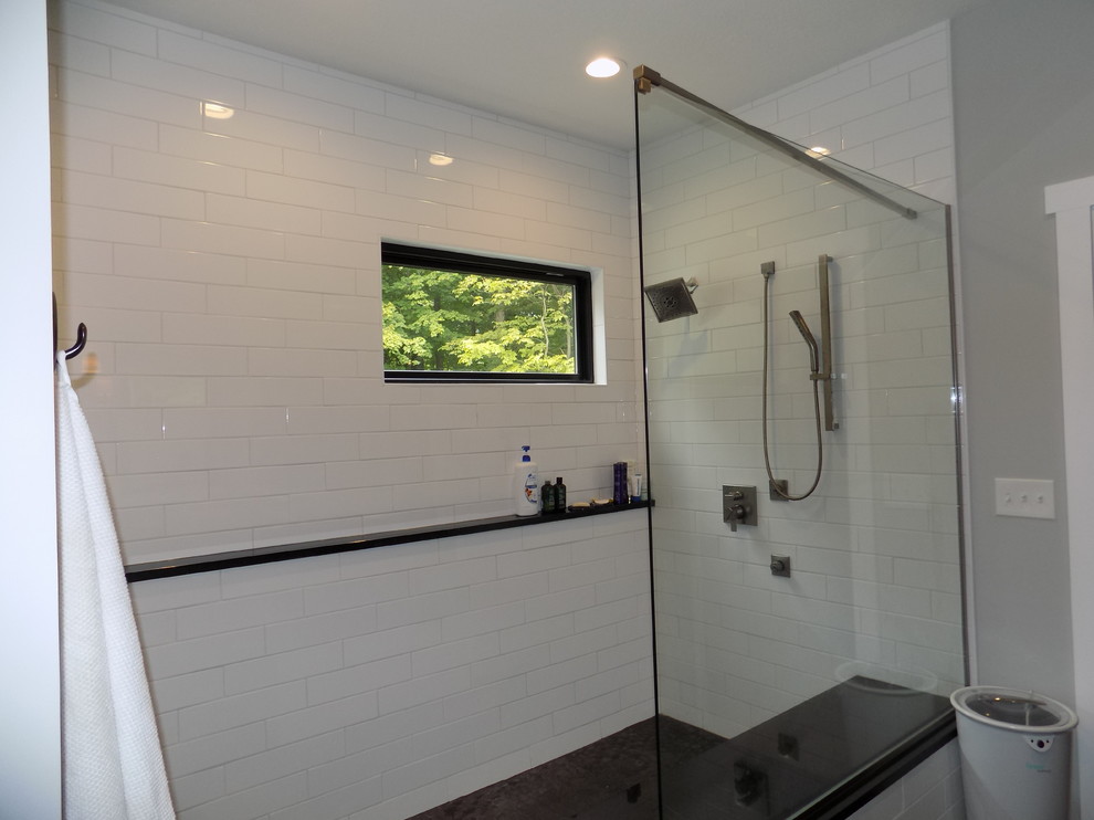 Mid-sized arts and crafts master bathroom in Columbus with recessed-panel cabinets, white cabinets, an alcove tub, a curbless shower, a two-piece toilet, white tile, ceramic tile, white walls, ceramic floors, an undermount sink, engineered quartz benchtops, black floor, an open shower and beige benchtops.