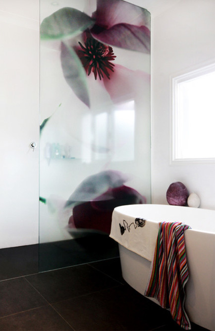 Design ideas for a mid-sized contemporary bathroom in Canberra - Queanbeyan with flat-panel cabinets, a freestanding tub, an alcove shower, ceramic tile, white walls, ceramic floors, an undermount sink, marble benchtops, black floor and an open shower.