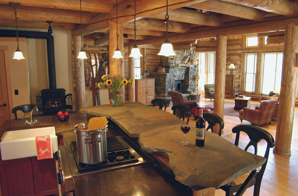 Inspiration for a large rustic l-shaped light wood floor eat-in kitchen remodel with a double-bowl sink, flat-panel cabinets, medium tone wood cabinets, stainless steel appliances and an island