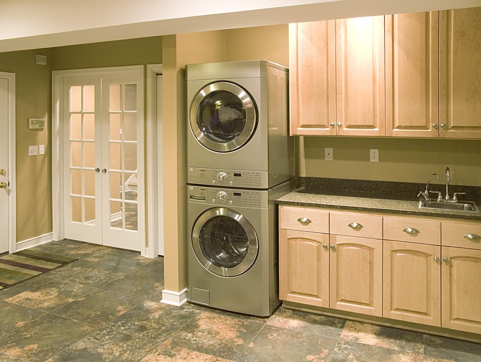 Traditional laundry room in Minneapolis with green benchtop.