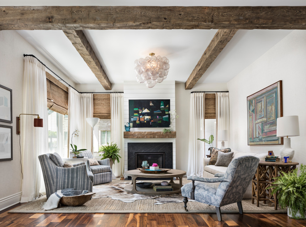 Design ideas for a transitional open concept living room in Detroit with white walls, dark hardwood floors, a standard fireplace and brown floor.