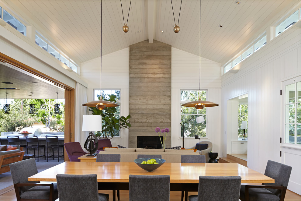Design ideas for a large country open plan dining in Los Angeles with white walls and light hardwood floors.