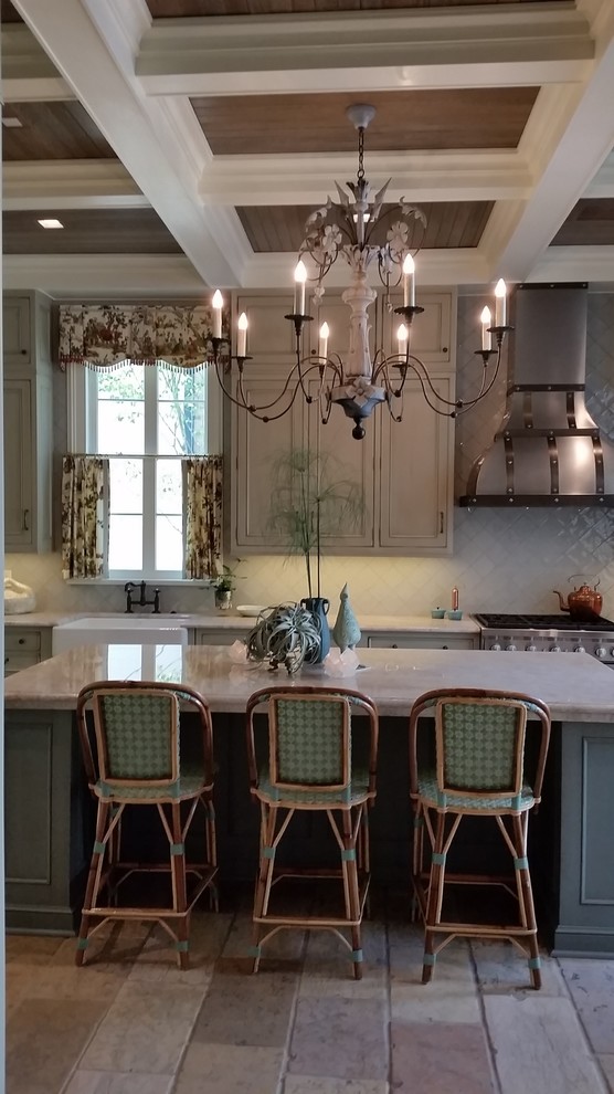 Large traditional separate kitchen in New Orleans with a farmhouse sink, beaded inset cabinets, green cabinets, quartzite benchtops, blue splashback, ceramic splashback, stainless steel appliances, limestone floors, with island, multi-coloured floor and white benchtop.