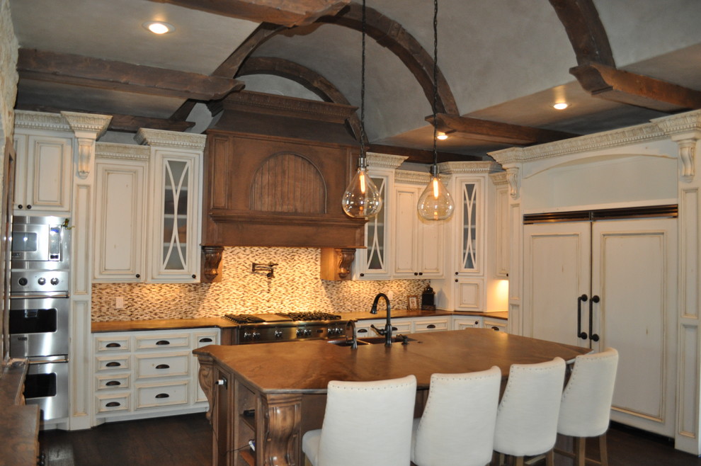 Inspiration for a large transitional l-shaped dark wood floor kitchen remodel in Austin with recessed-panel cabinets, white cabinets, mosaic tile backsplash, stainless steel appliances and an island