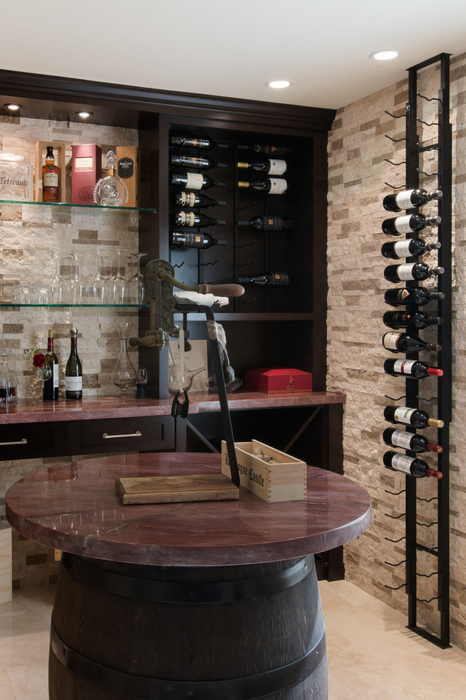 Design ideas for a mediterranean wine cellar in Orange County with storage racks.
