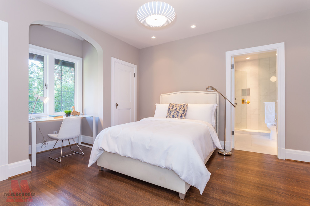 Inspiration for a large contemporary guest bedroom in Vancouver with beige walls, medium hardwood floors, a standard fireplace and a tile fireplace surround.