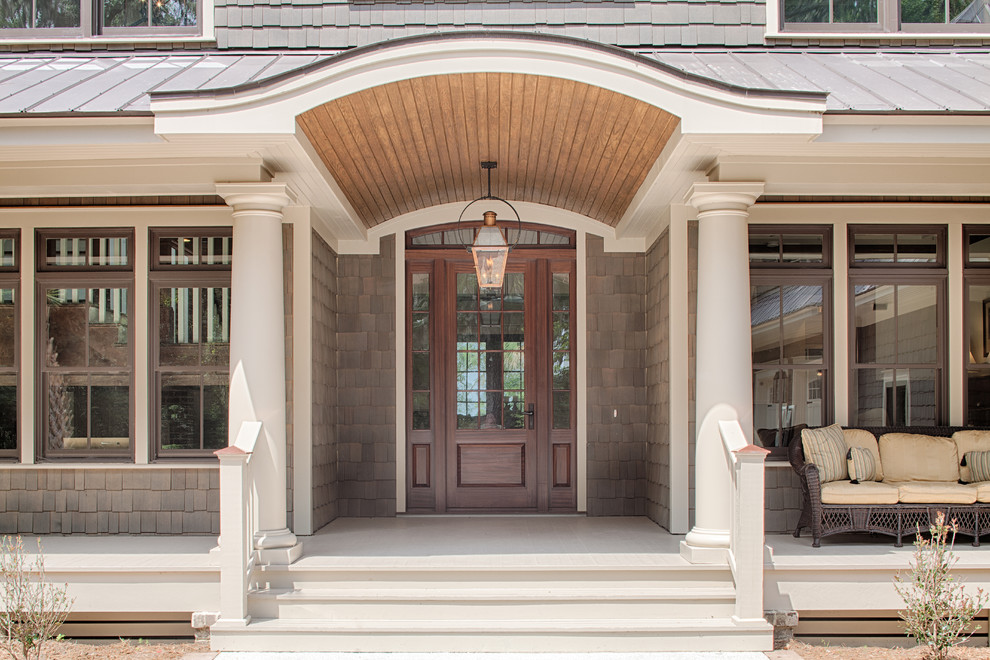 Inspiration for a large timeless gray two-story concrete fiberboard gable roof remodel in Grand Rapids