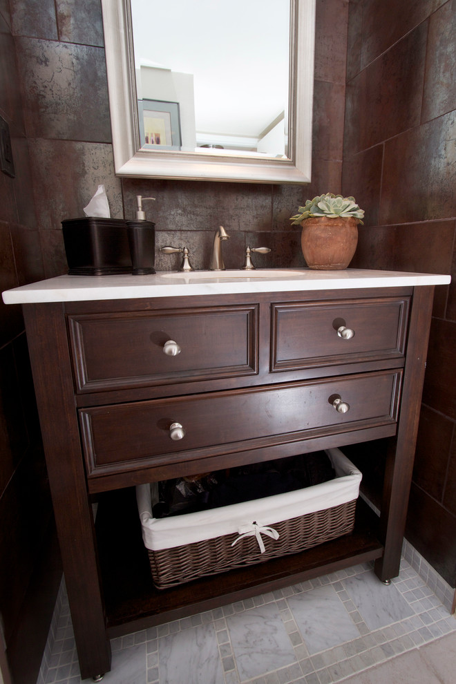 Bathroom - small transitional brown tile and porcelain tile marble floor bathroom idea in Phoenix with dark wood cabinets, quartzite countertops and brown walls
