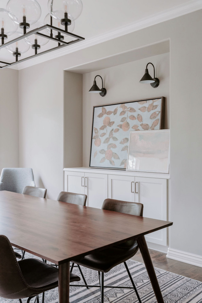 Example of a transitional dining room design in Omaha