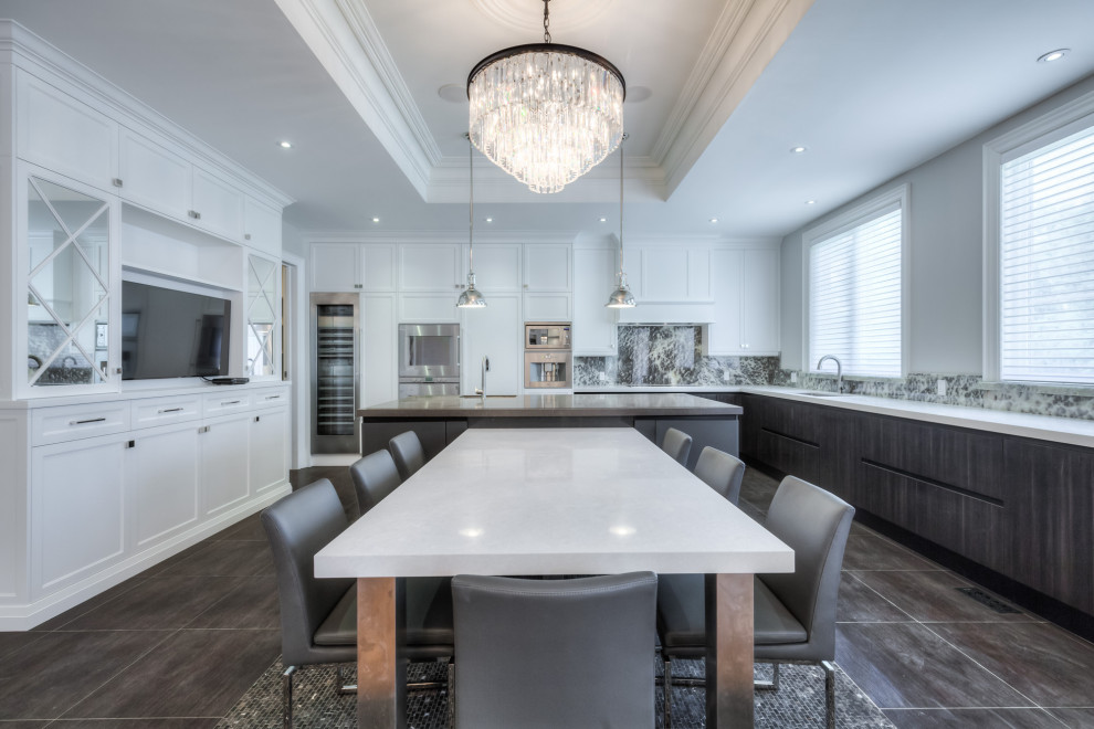 Inspiration for a transitional kitchen remodel in Toronto with shaker cabinets, white cabinets, stainless steel appliances and an island