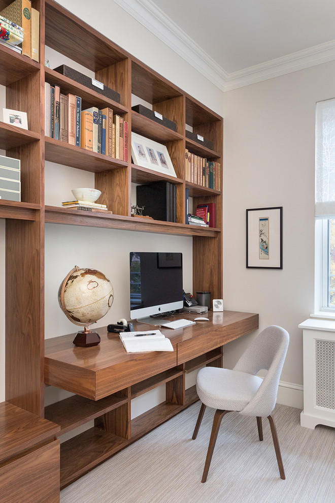 Transitional study room in New York with grey walls and a built-in desk.