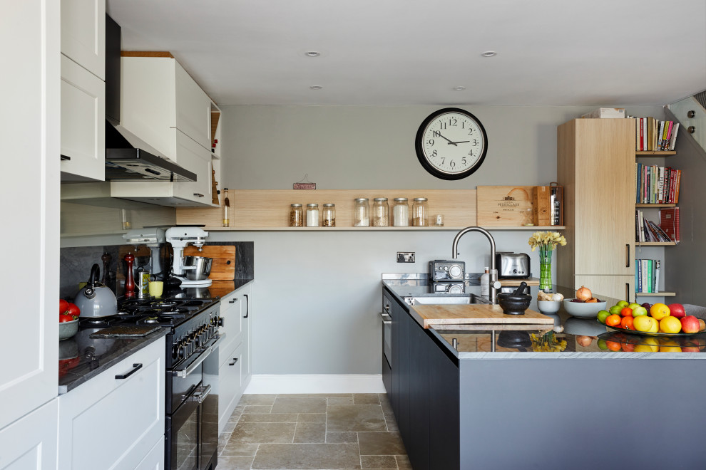 Inspiration for a mid-sized transitional single-wall eat-in kitchen in London with shaker cabinets, white cabinets, quartz benchtops, grey splashback, stone slab splashback, with island and grey benchtop.