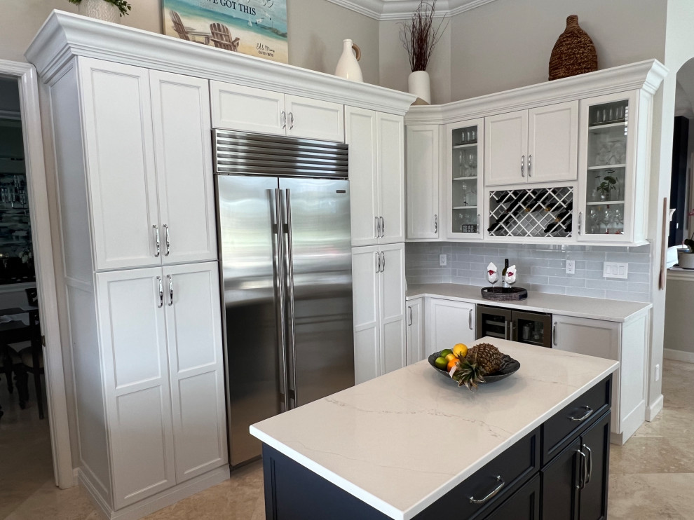 Inspiration for a transitional eat-in kitchen in Other with shaker cabinets, white cabinets, quartz benchtops, stainless steel appliances, with island and white benchtop.