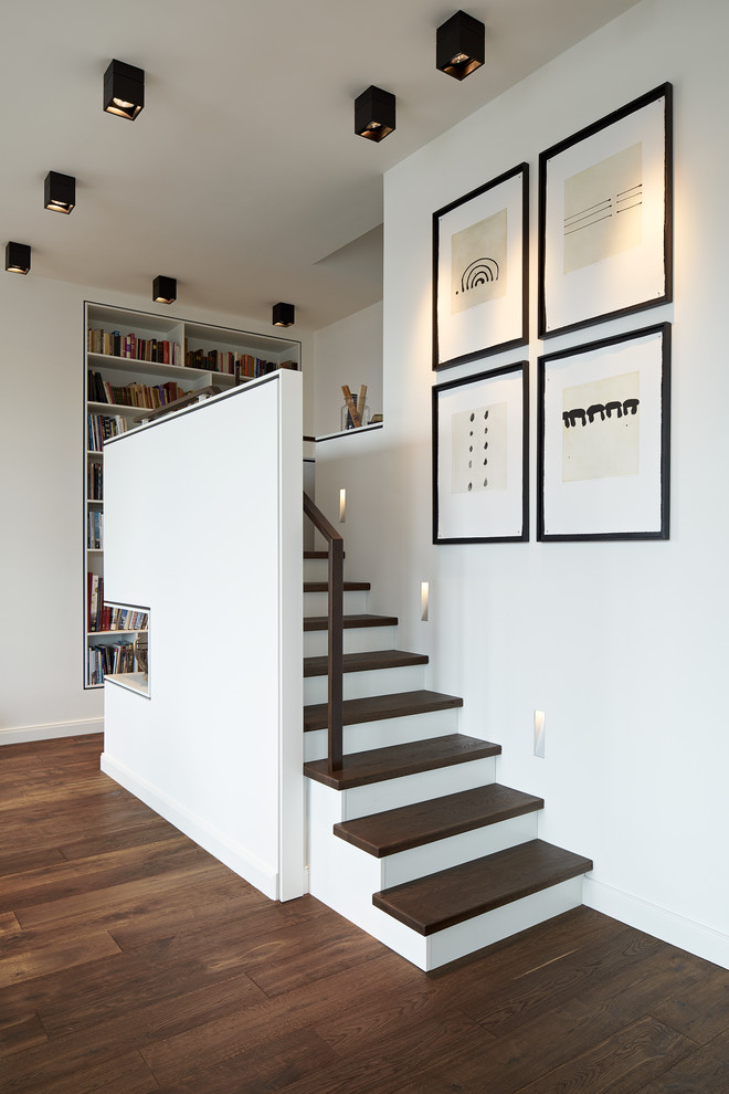 Design ideas for a contemporary wood straight staircase in Hamburg.