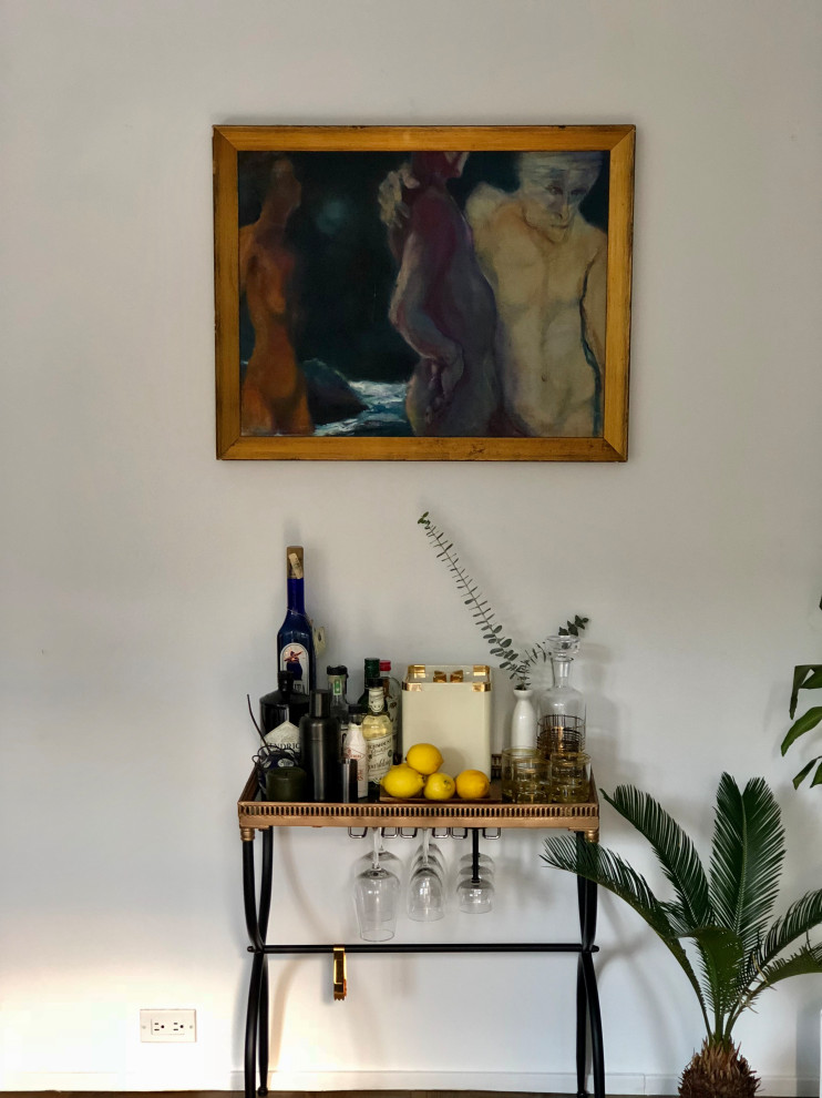 A dramatic painting by a local artist plays backdrop for the home bar