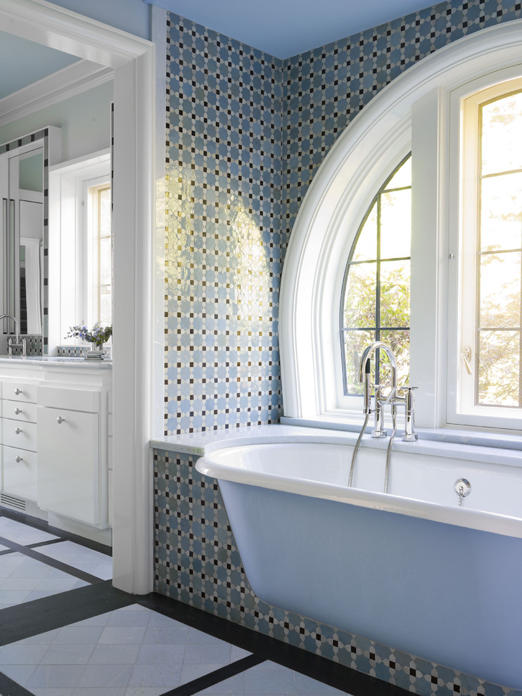 Inspiration for a traditional bathroom in New York with mosaic tile.