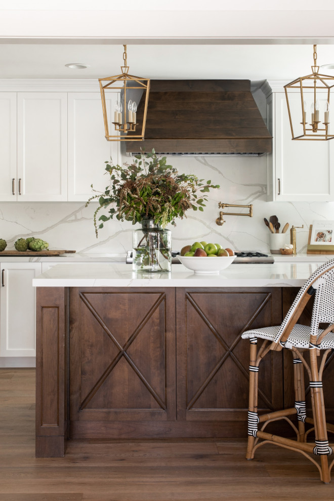 Eat-in kitchen - large farmhouse galley eat-in kitchen idea in Los Angeles with a farmhouse sink, recessed-panel cabinets, white cabinets, quartz countertops, quartz backsplash, stainless steel appliances, an island and white countertops