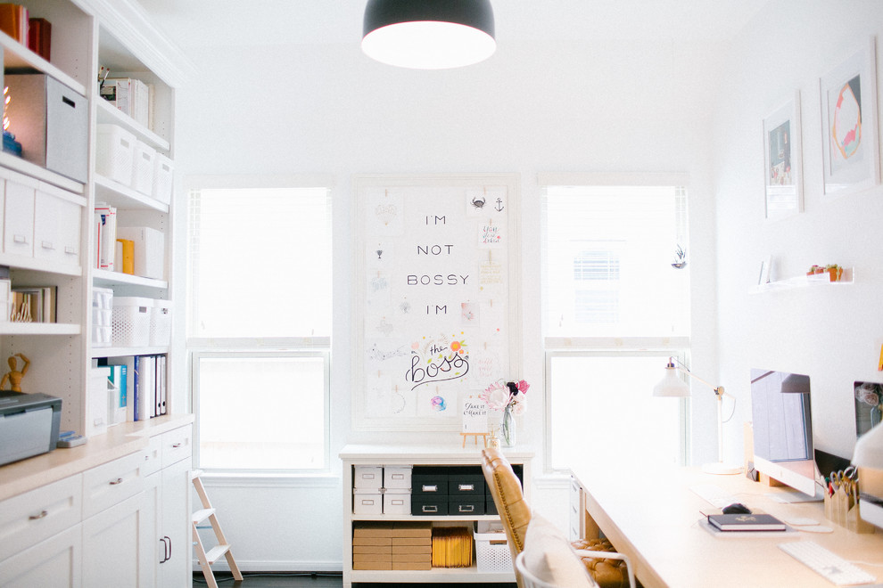 Example of a mid-sized danish freestanding desk home studio design in Houston with white walls and no fireplace