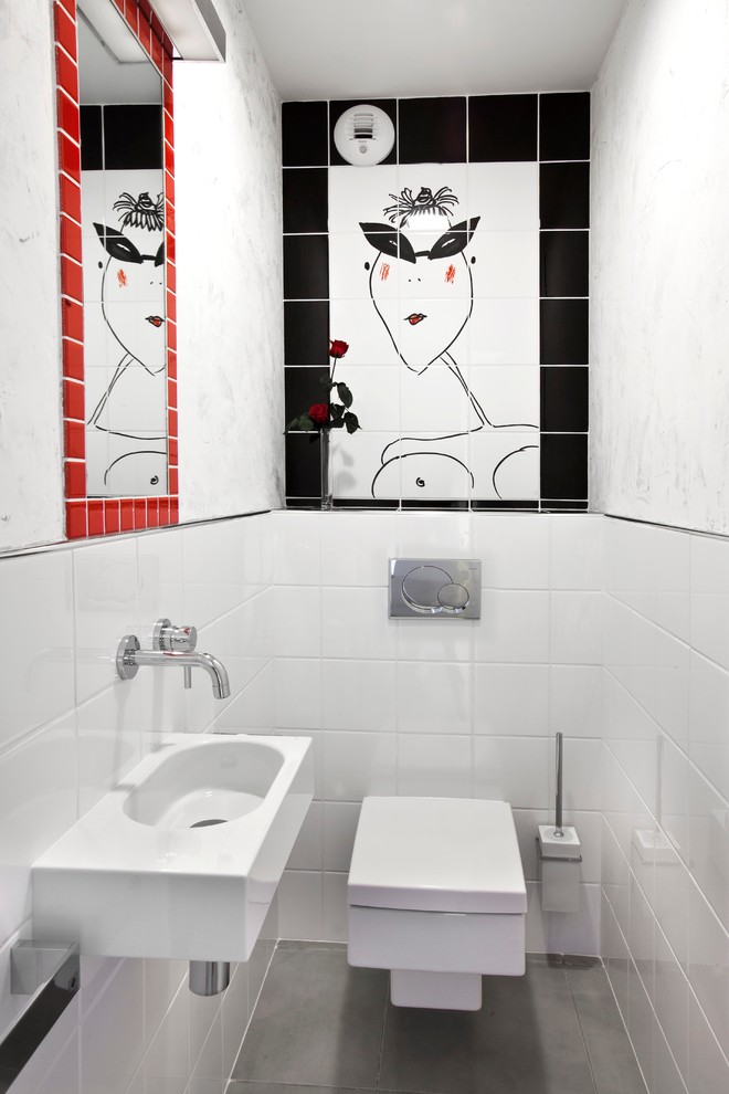 Inspiration for a small contemporary powder room in Montpellier with a wall-mount toilet, ceramic tile, white walls, ceramic floors and a wall-mount sink.