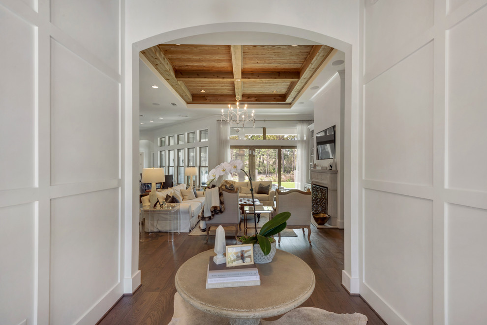 Large beach style foyer in Other with beige walls, medium hardwood floors, a single front door and a medium wood front door.