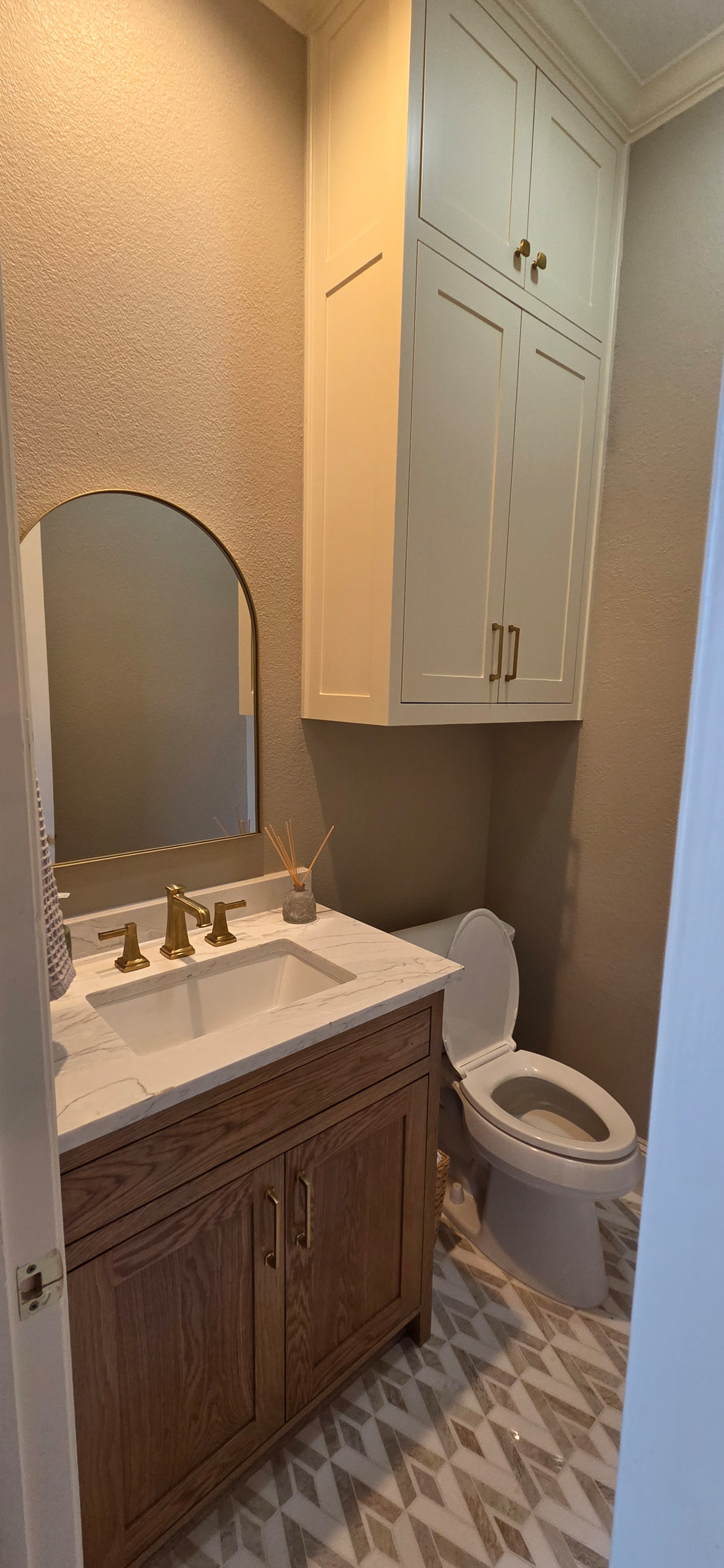Use the tile from the shower for the floor in the extra half bathroom/powder room close to the kitchen. marble countertops, deep sink, beautiful faucet.
