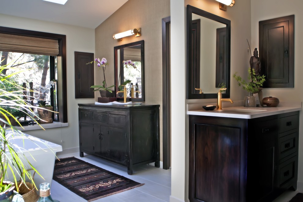 Inspiration for an asian master bathroom in Other with dark wood cabinets, a freestanding tub and beige walls.